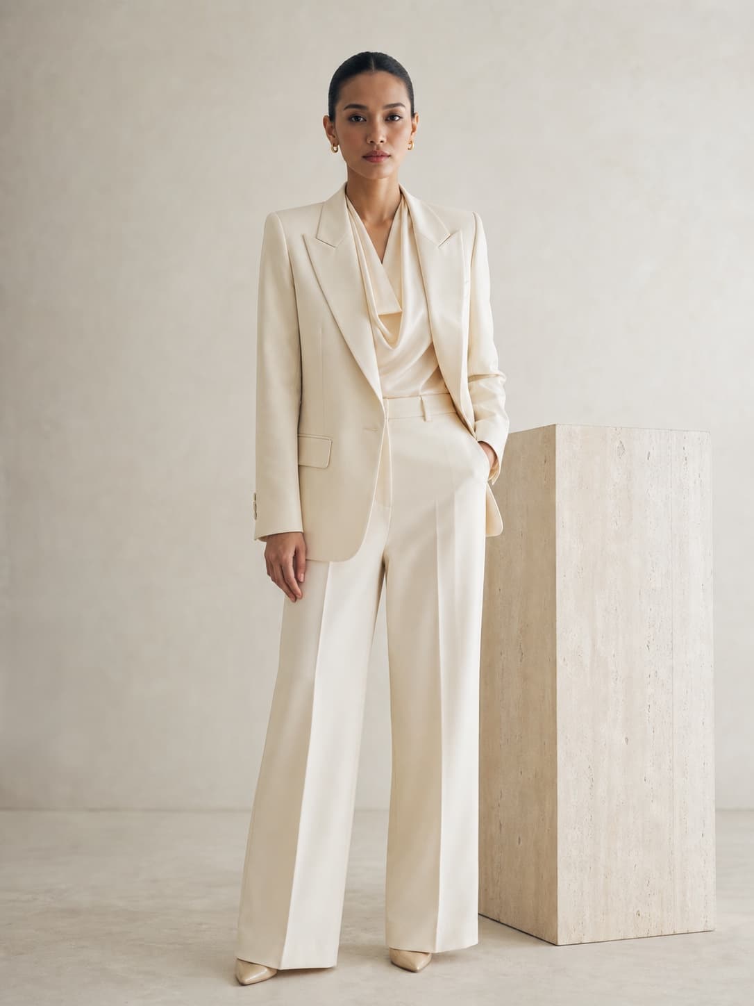 Woman in an ivory tailored suit