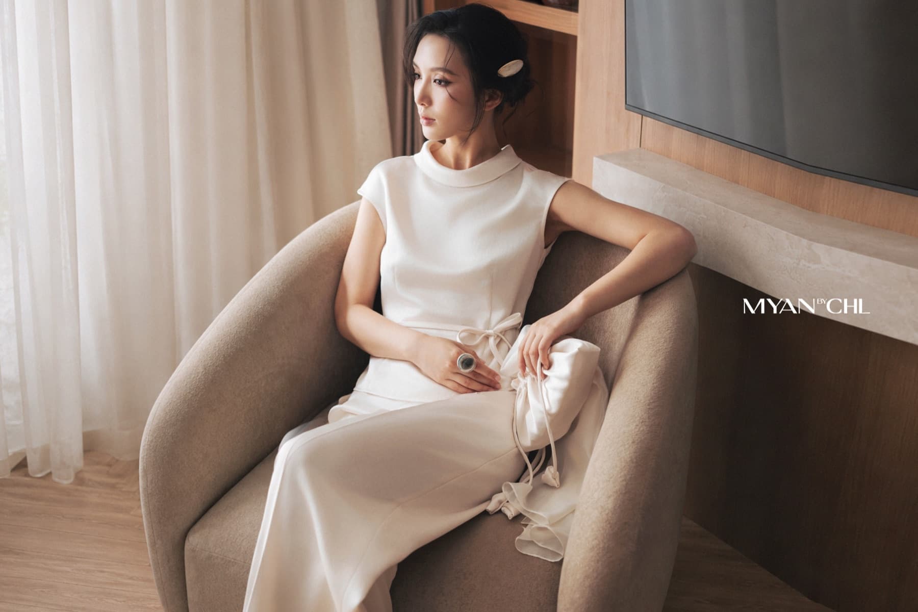 MYAN Silk Horizon campaign with a woman in an ivory dress