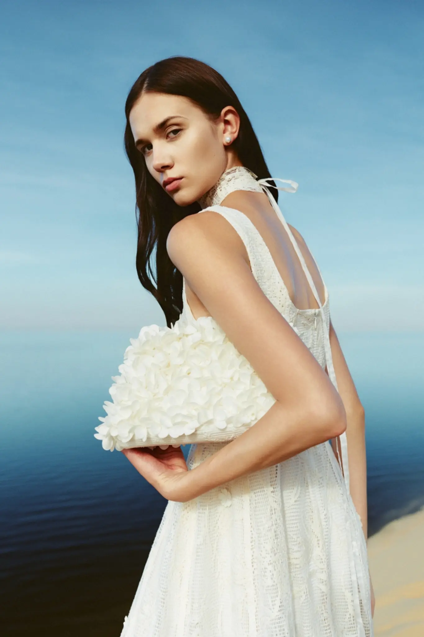WHITE ANT Time Machine campaign with a woman holding a floral bag